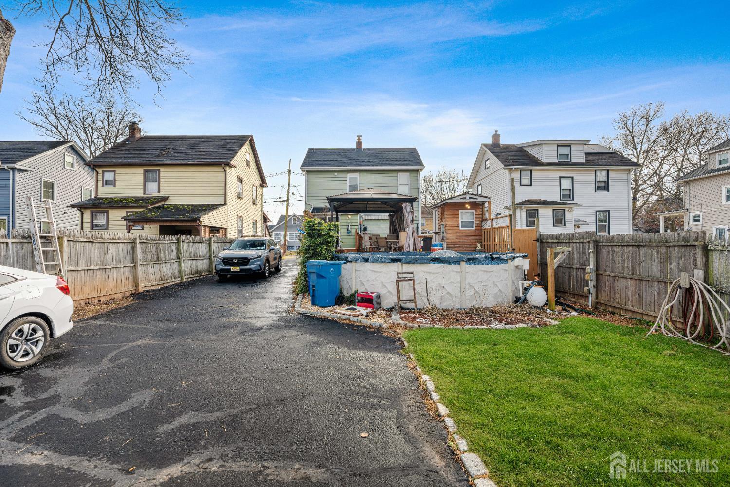 210 2nd Street Dunellen, NJ 08812 - Photo 34 of 42 a view of a cars park in front of a house