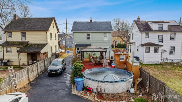 a view of a patio with table and chairs and potted plants