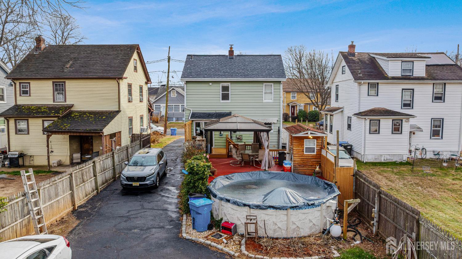 210 2nd Street Dunellen, NJ 08812 - Photo 36 of 42 a view of a patio with table and chairs and potted plants