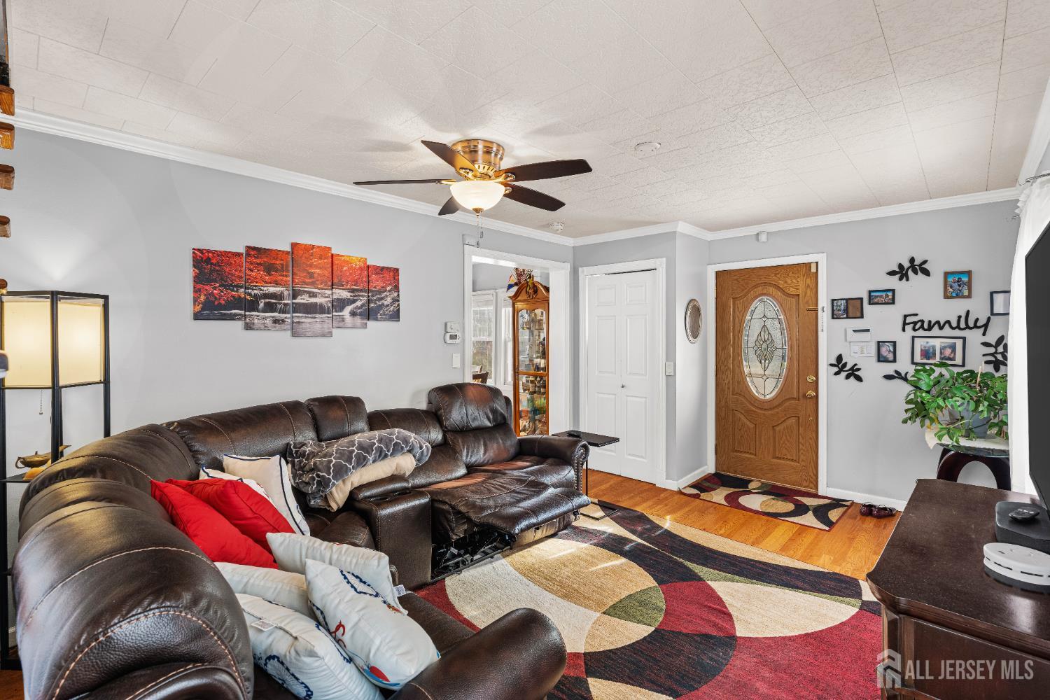 210 2nd Street Dunellen, NJ 08812 - Photo 5 of 42 a living room with furniture and a flat screen tv