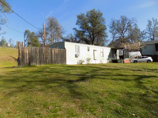 a view of a house with a big yard