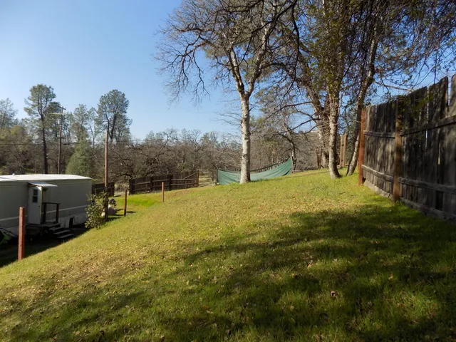 a view of a yard with swimming pool