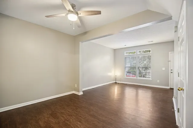 a kitchen with stainless steel appliances granite countertop a refrigerator stove top oven and sink