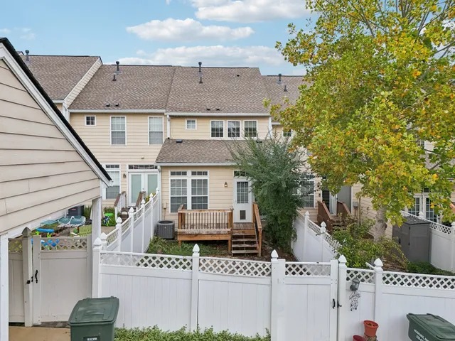 an aerial view of residential building with green space