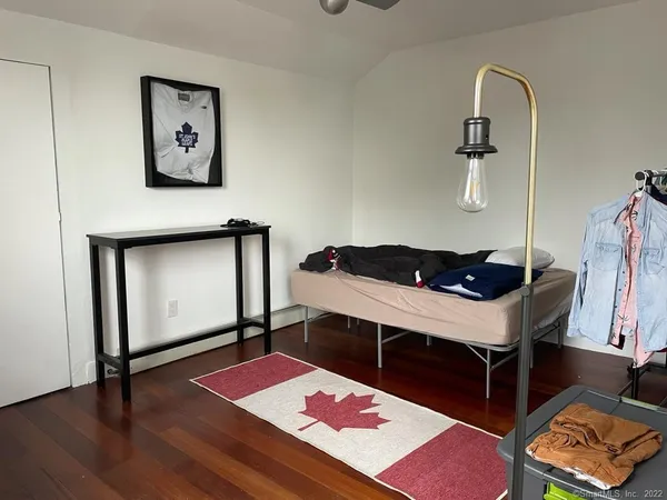 a view of an entryway with wooden floor