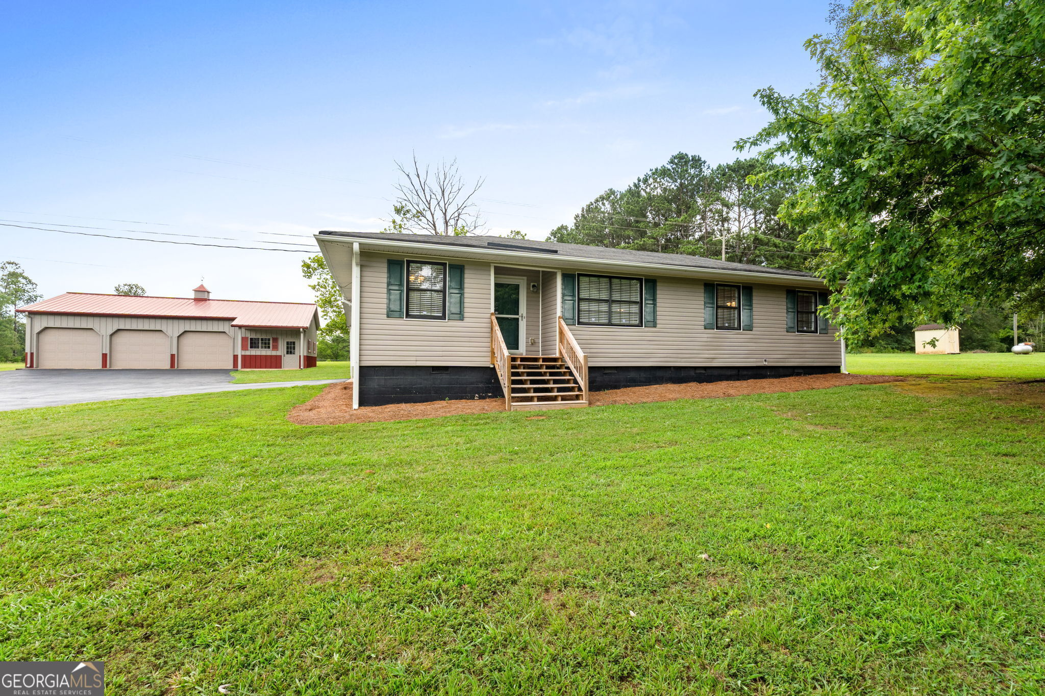 326 Burg Road Jenkinsburg, GA 30234 - Photo 1 of 1 a house view with a garden space