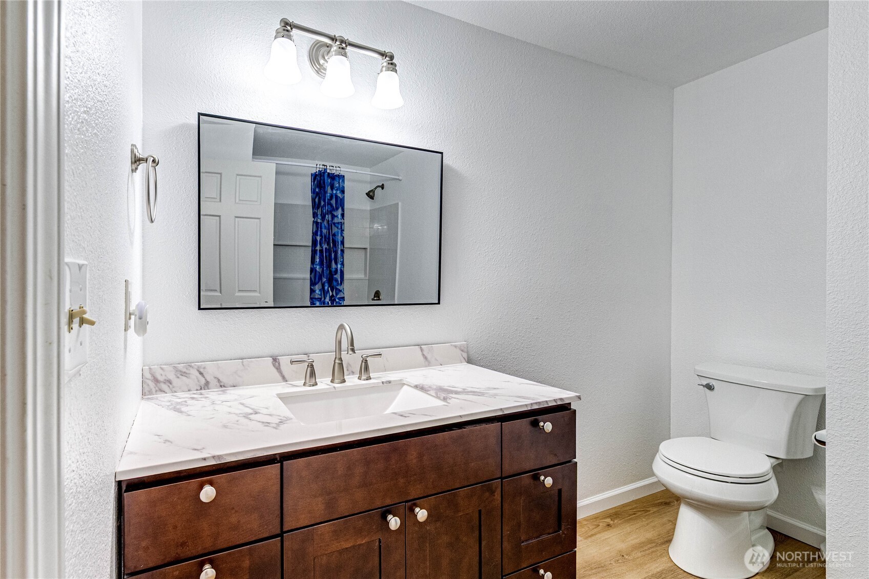 321 216th Street Southeast Bothell, WA 98021 - Photo 17 of 33 a bathroom with a toilet a sink and mirror