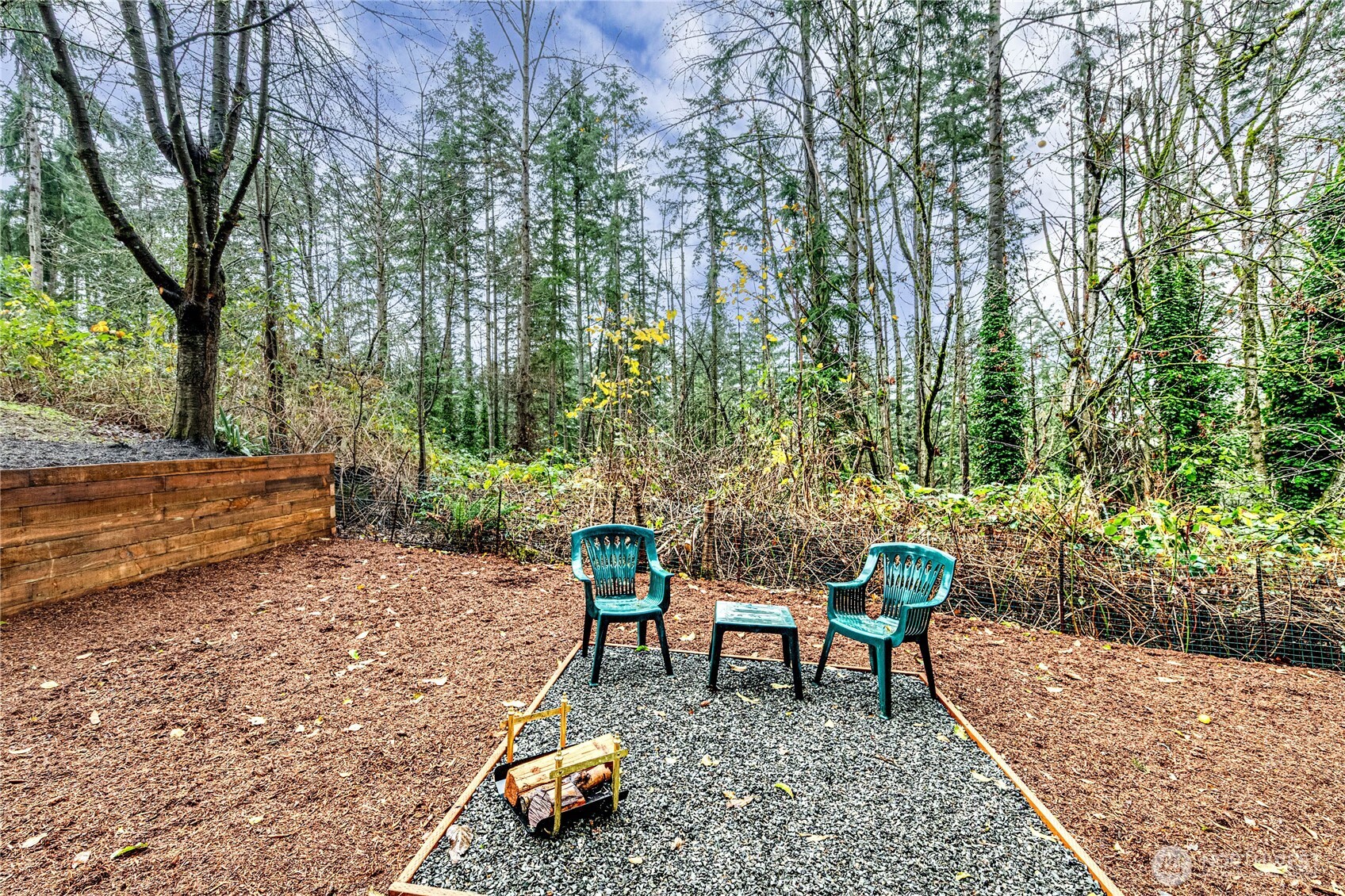 321 216th Street Southeast Bothell, WA 98021 - Photo 28 of 33 a chair and table sitting in backyard of the house