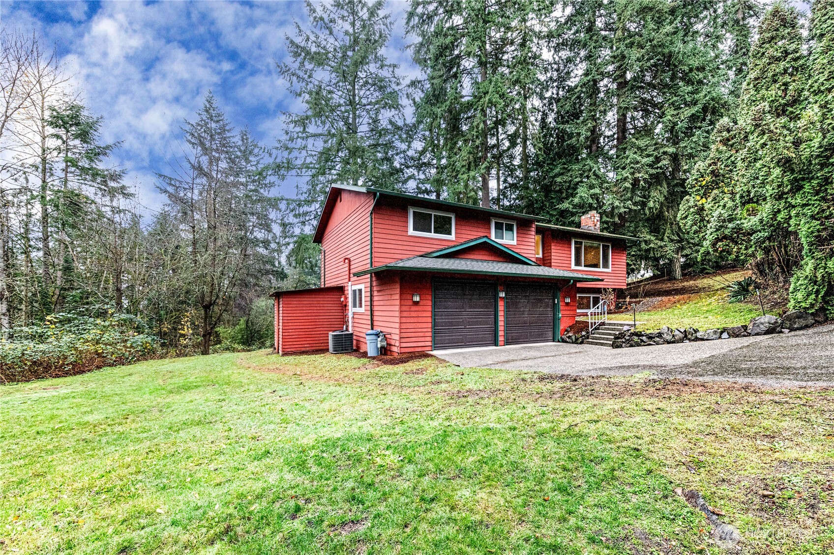 321 216th Street Southeast Bothell, WA 98021 - Photo 32 of 33 a front view of a house with a yard and garage