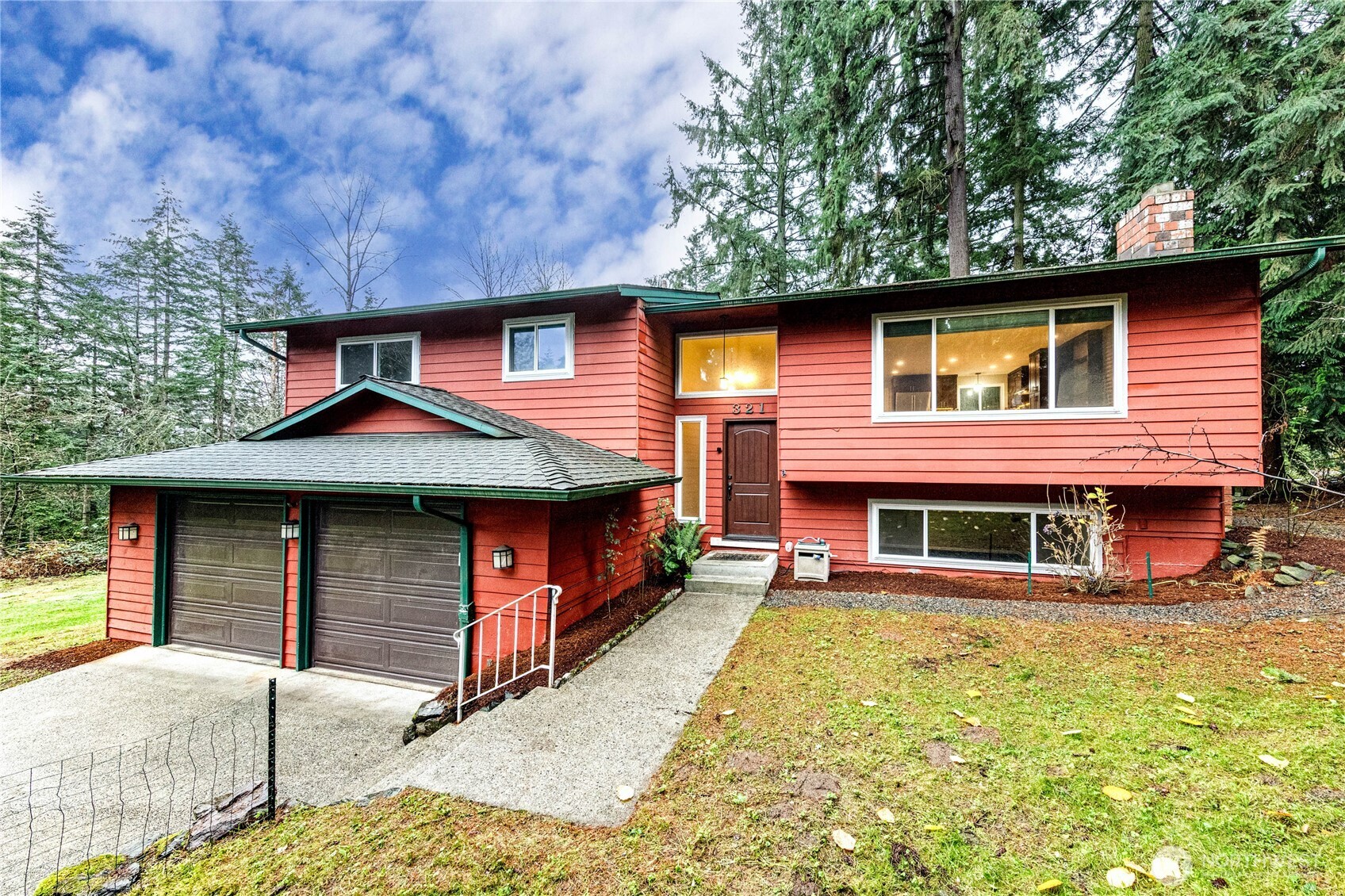 321 216th Street Southeast Bothell, WA 98021 - Photo 33 of 33 a front view of a house with a yard outdoor seating and garage