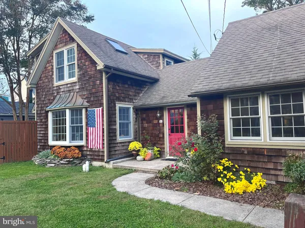 a front view of house with an outdoor seating