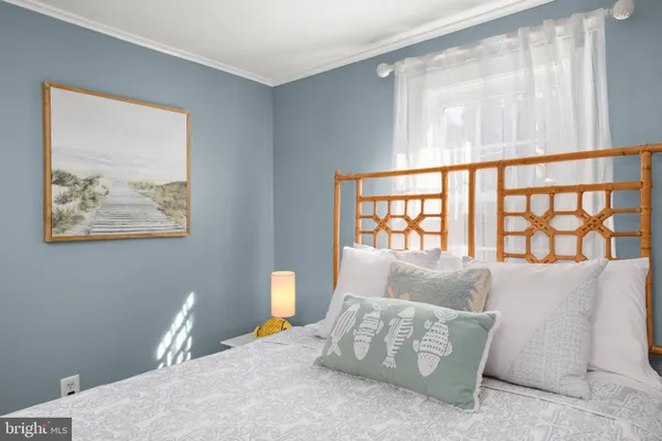 a bedroom with furniture and a window