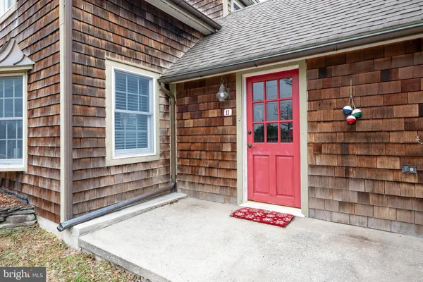 a table and chairs in front of a building