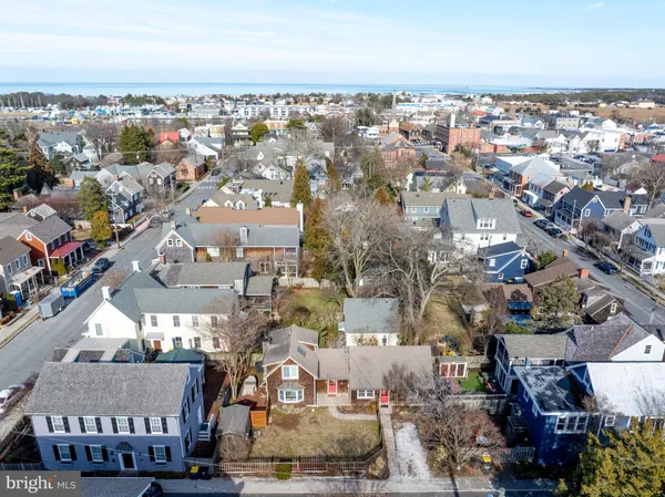 a view of a patio with table and chairs and potted plants