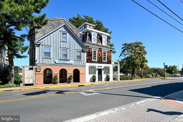 a view of a swimming pool with a patio and a garden