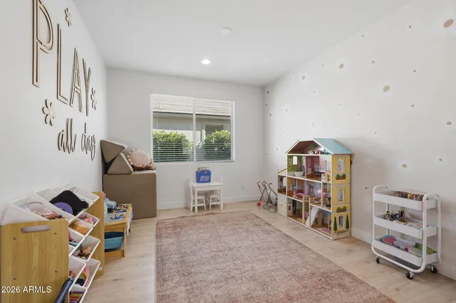 a bedroom with furniture and a window