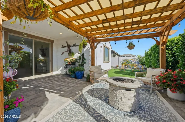a view of a porch with furniture and garden