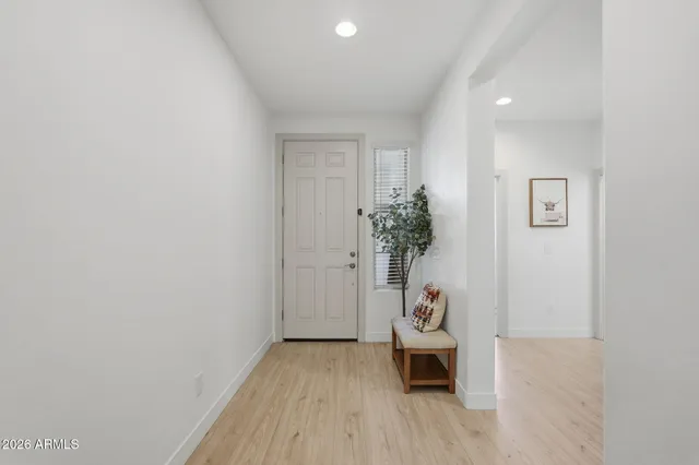a hallway with wooden floor