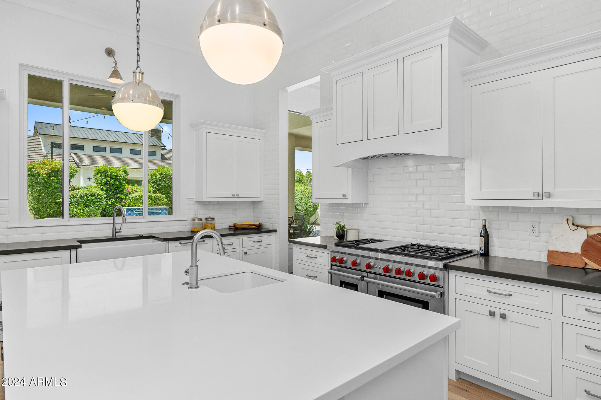 2654 East Warbler Road Gilbert, AZ 85297 - Photo 12 of 50 a kitchen that has a lot of cabinets in it