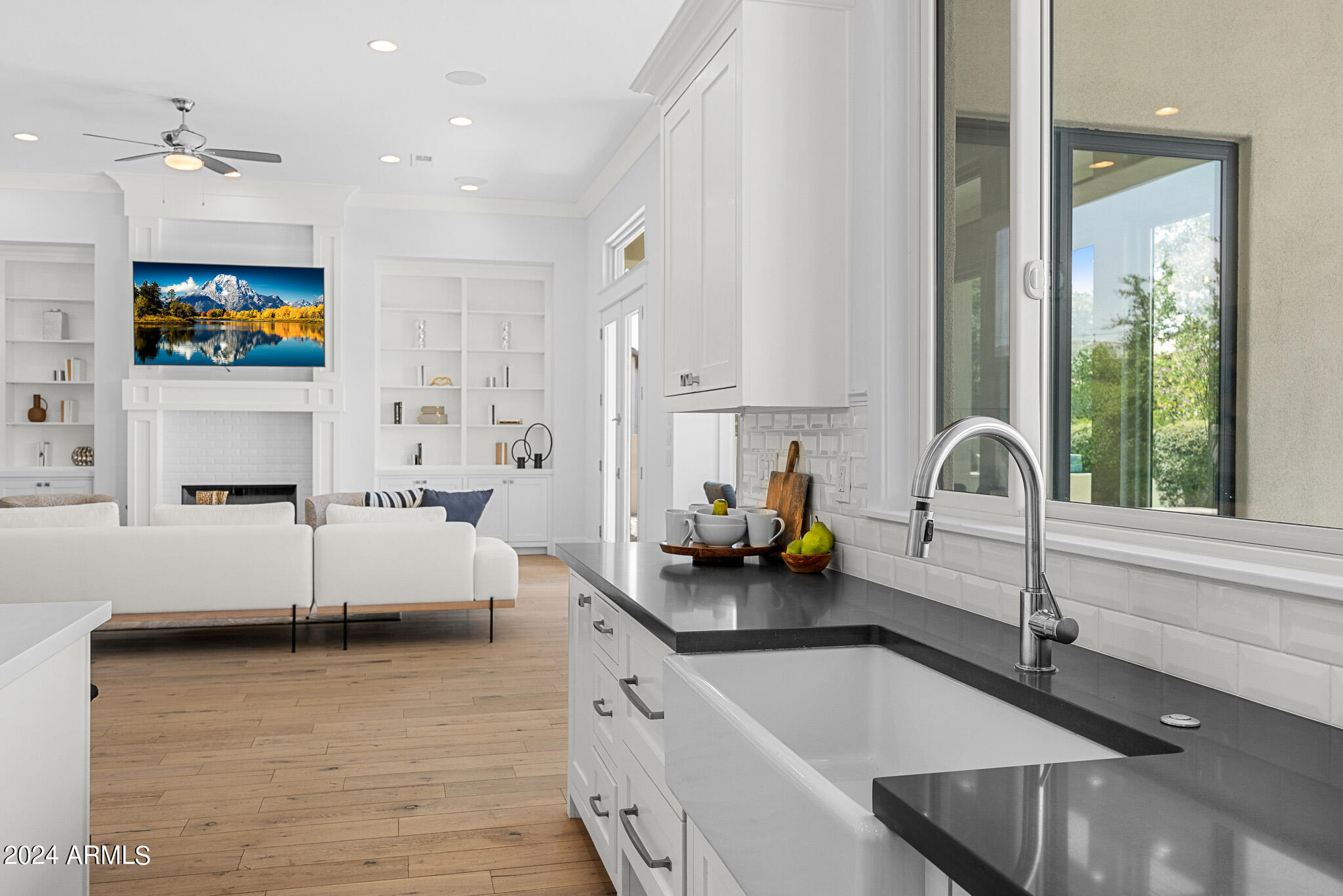 2654 East Warbler Road Gilbert, AZ 85297 - Photo 15 of 50 a kitchen with sink a microwave and cabinets