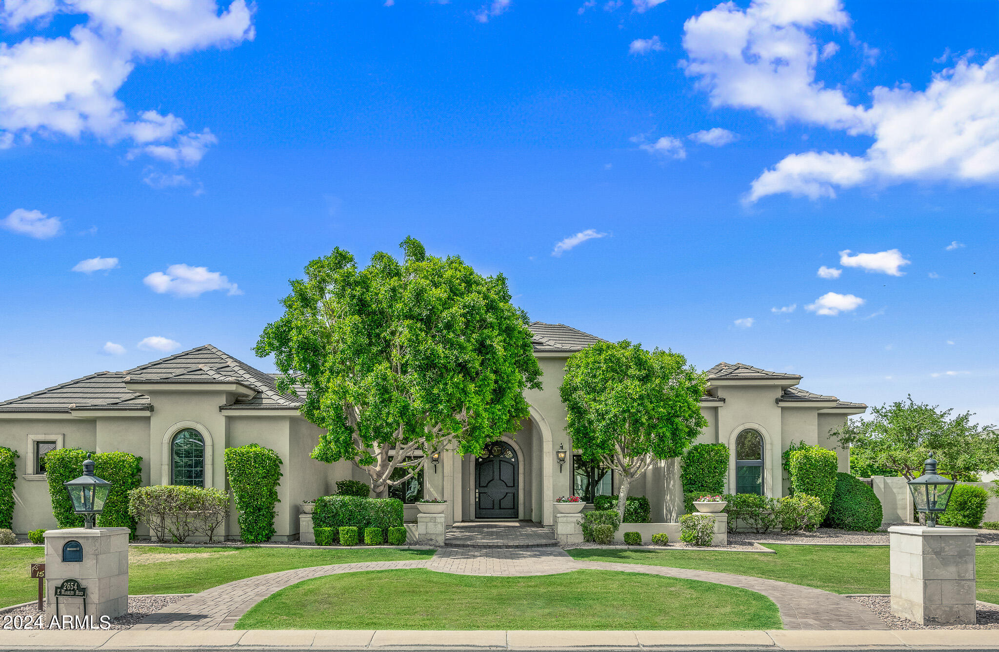 2654 East Warbler Road Gilbert, AZ 85297 - Photo 2 of 50 a front view of a house with a yard