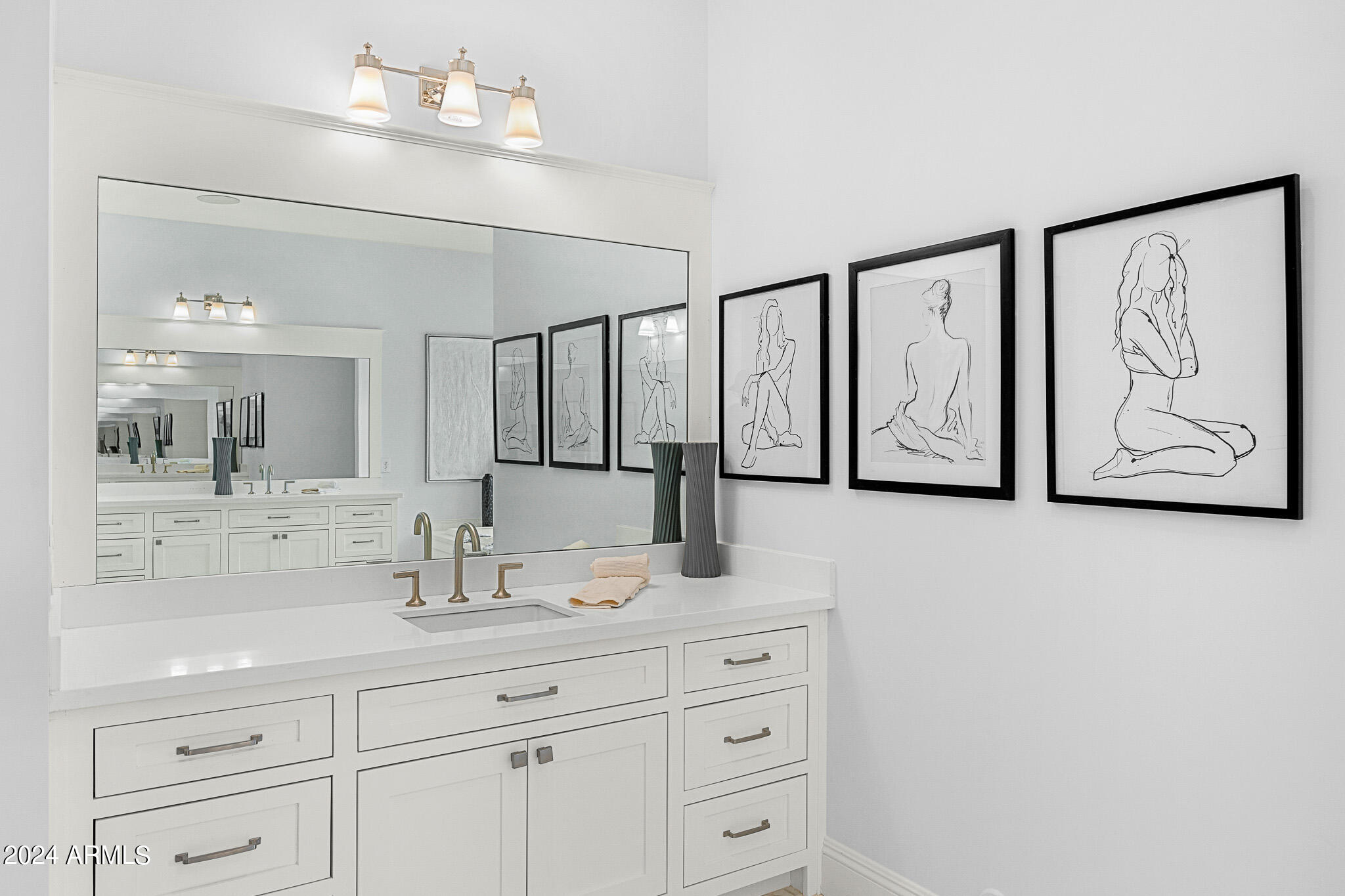 2654 East Warbler Road Gilbert, AZ 85297 - Photo 26 of 50 a bathroom with a sink and a mirror