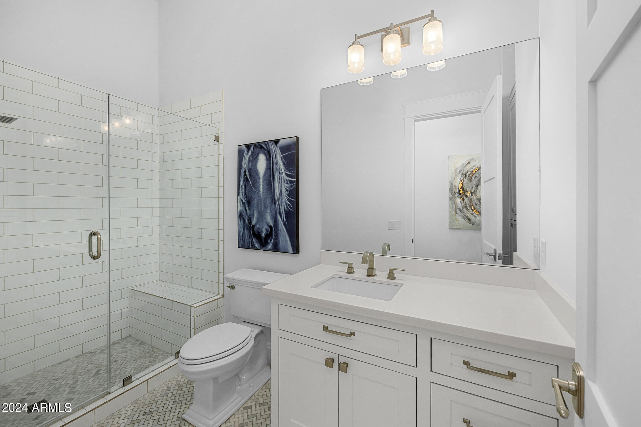 2654 East Warbler Road Gilbert, AZ 85297 - Photo 30 of 50 a bathroom with a sink a toilet and shower