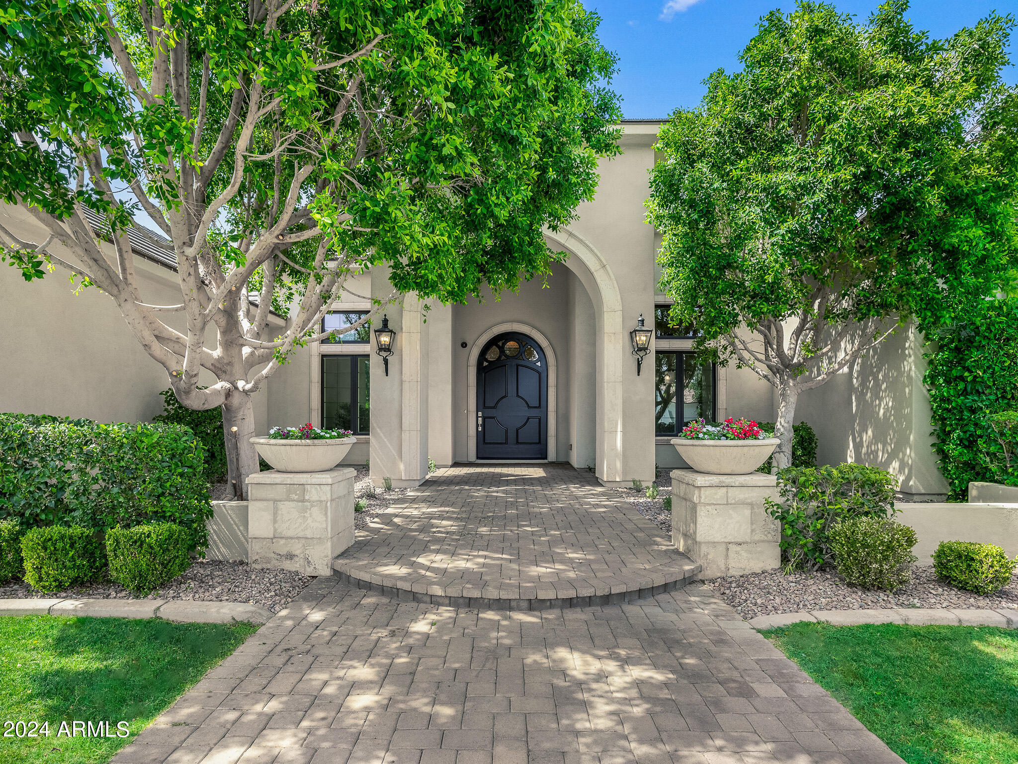 2654 East Warbler Road Gilbert, AZ 85297 - Photo 3 of 50 a view of a house with a yard and a large tree