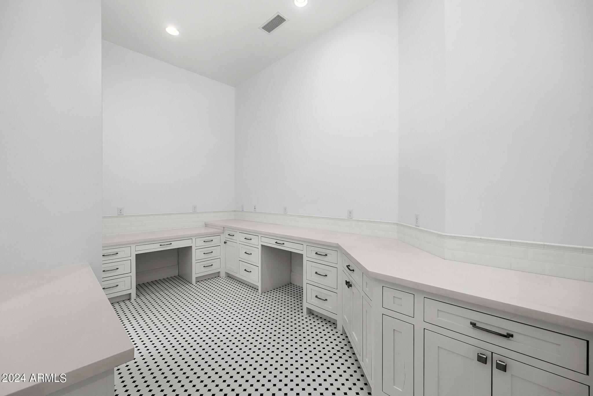 2654 East Warbler Road Gilbert, AZ 85297 - Photo 31 of 50 a room with a sink and cabinets