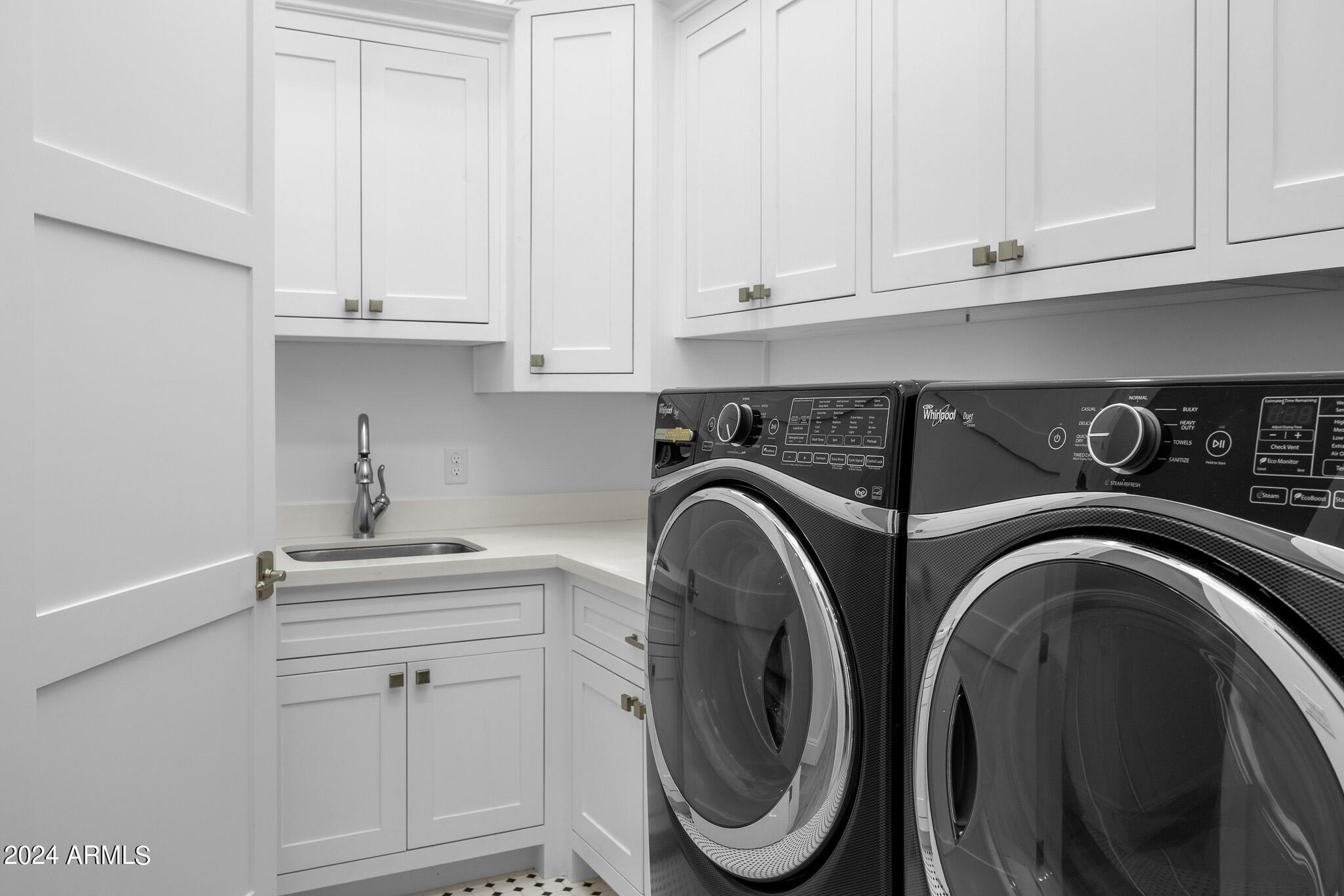 2654 East Warbler Road Gilbert, AZ 85297 - Photo 32 of 50 a utility room with sink dryer and washer