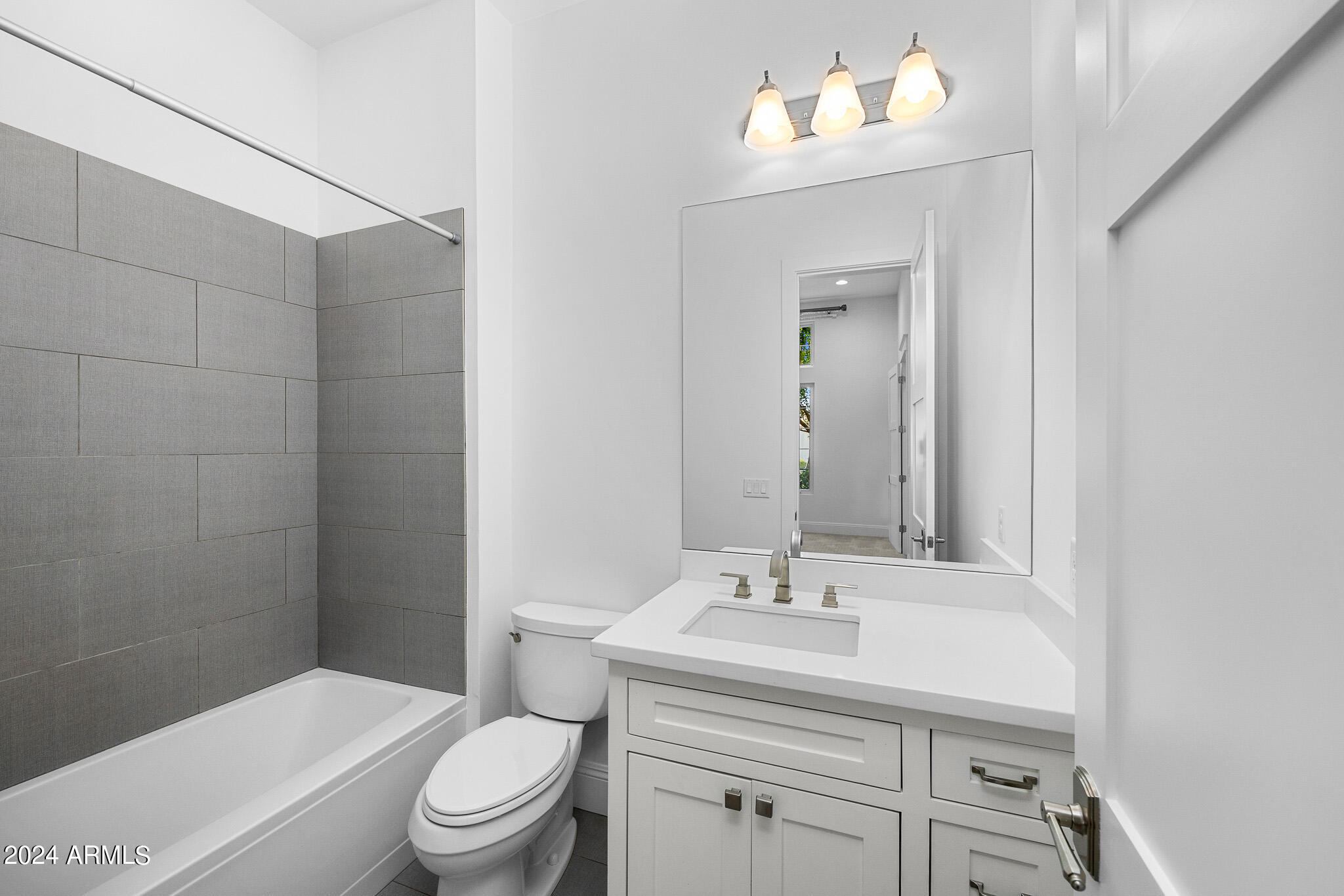 2654 East Warbler Road Gilbert, AZ 85297 - Photo 38 of 50 a bathroom with a sink toilet and a mirror