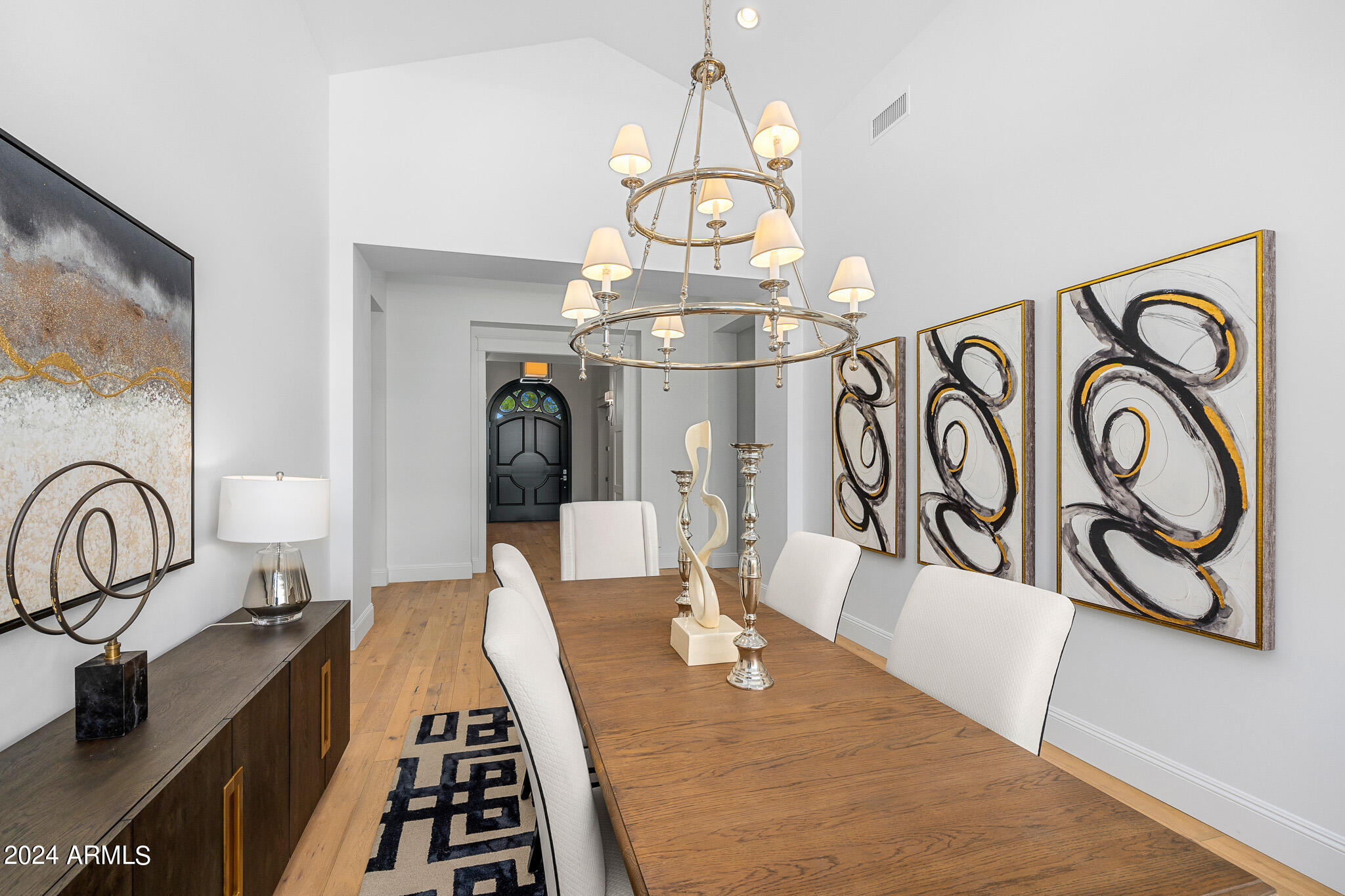 2654 East Warbler Road Gilbert, AZ 85297 - Photo 9 of 50 a view of a dining room with furniture and chandelier