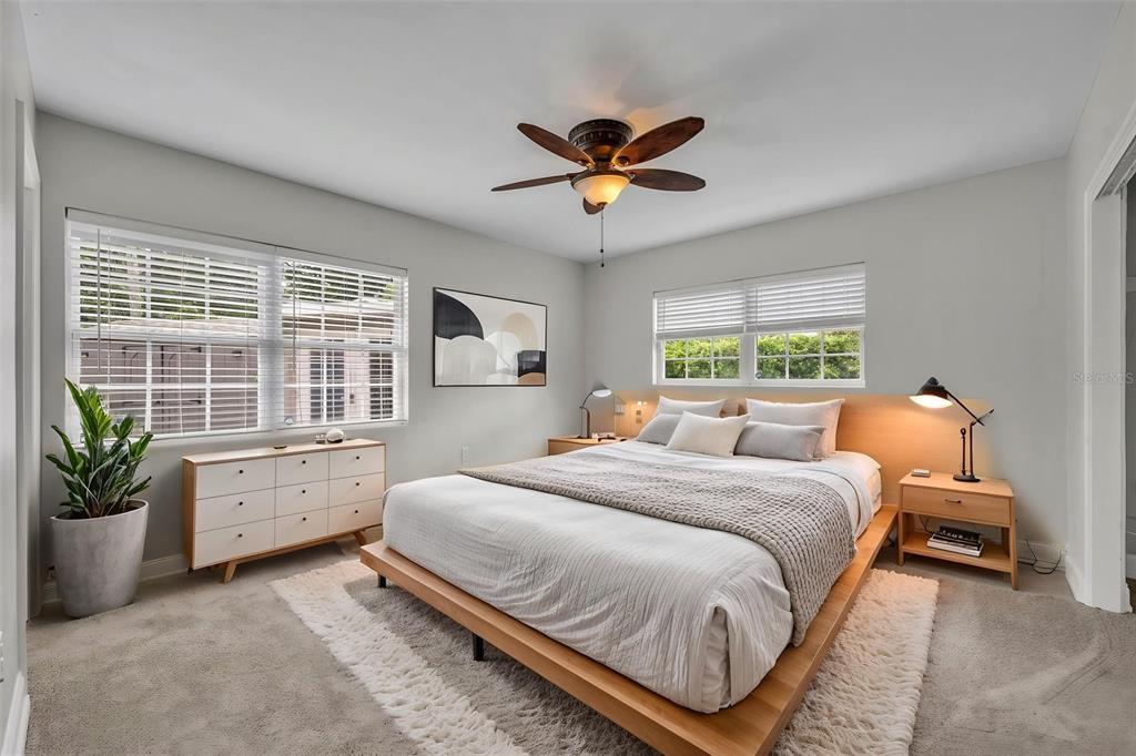 4234 Kendrick Road Orlando, FL 32804 - Photo 27 of 46 a bedroom with a bed dresser and a window