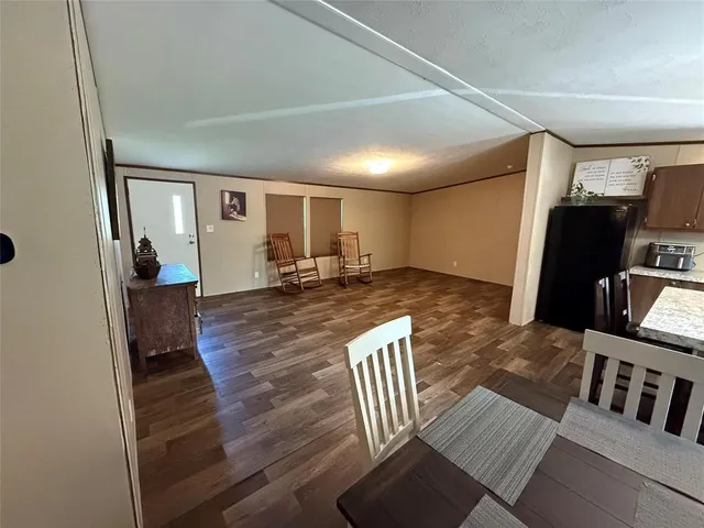 a view of a living room and wooden floor