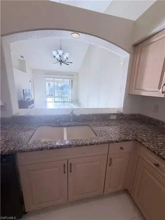 a kitchen with granite countertop granite countertop white cabinets and a granite counter tops
