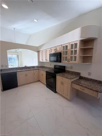 a large kitchen with cabinets
