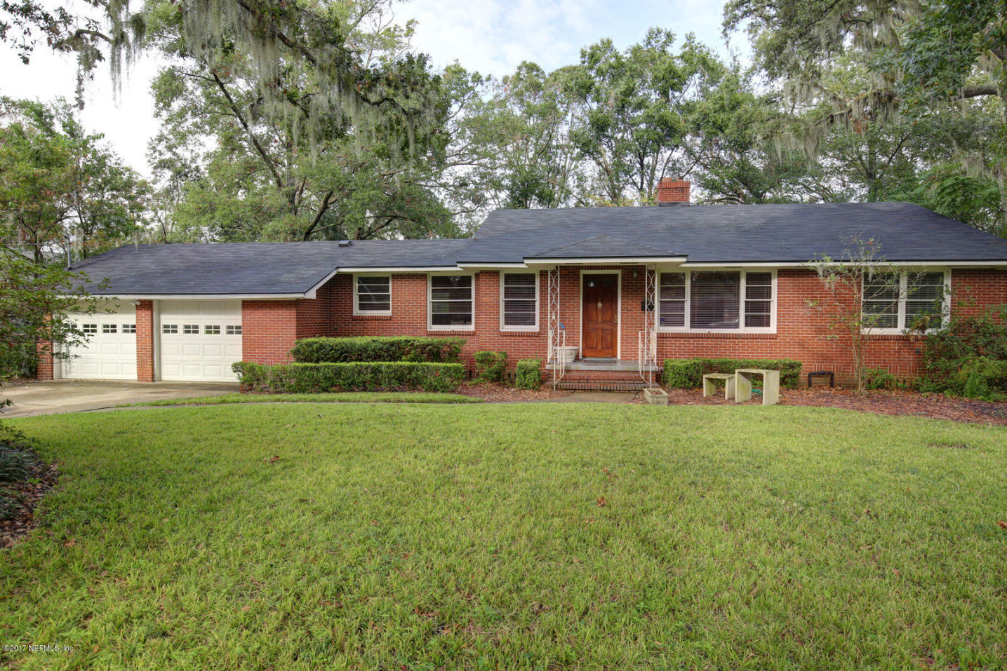 front view of a house with a yard