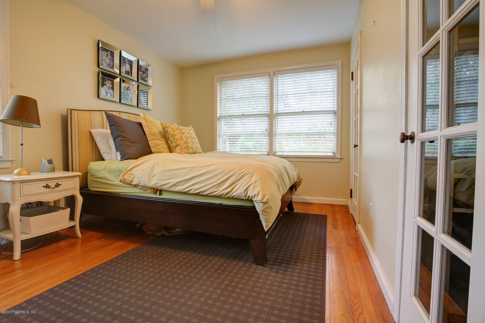 1361 Glengarry Road Jacksonville, FL 32207 - Photo 14 of 22 a bed room with a bed and a window