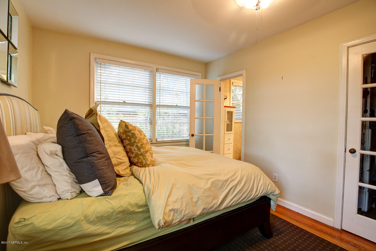 1361 Glengarry Road Jacksonville, FL 32207 - Photo 15 of 22 a bedroom with a bed and a window
