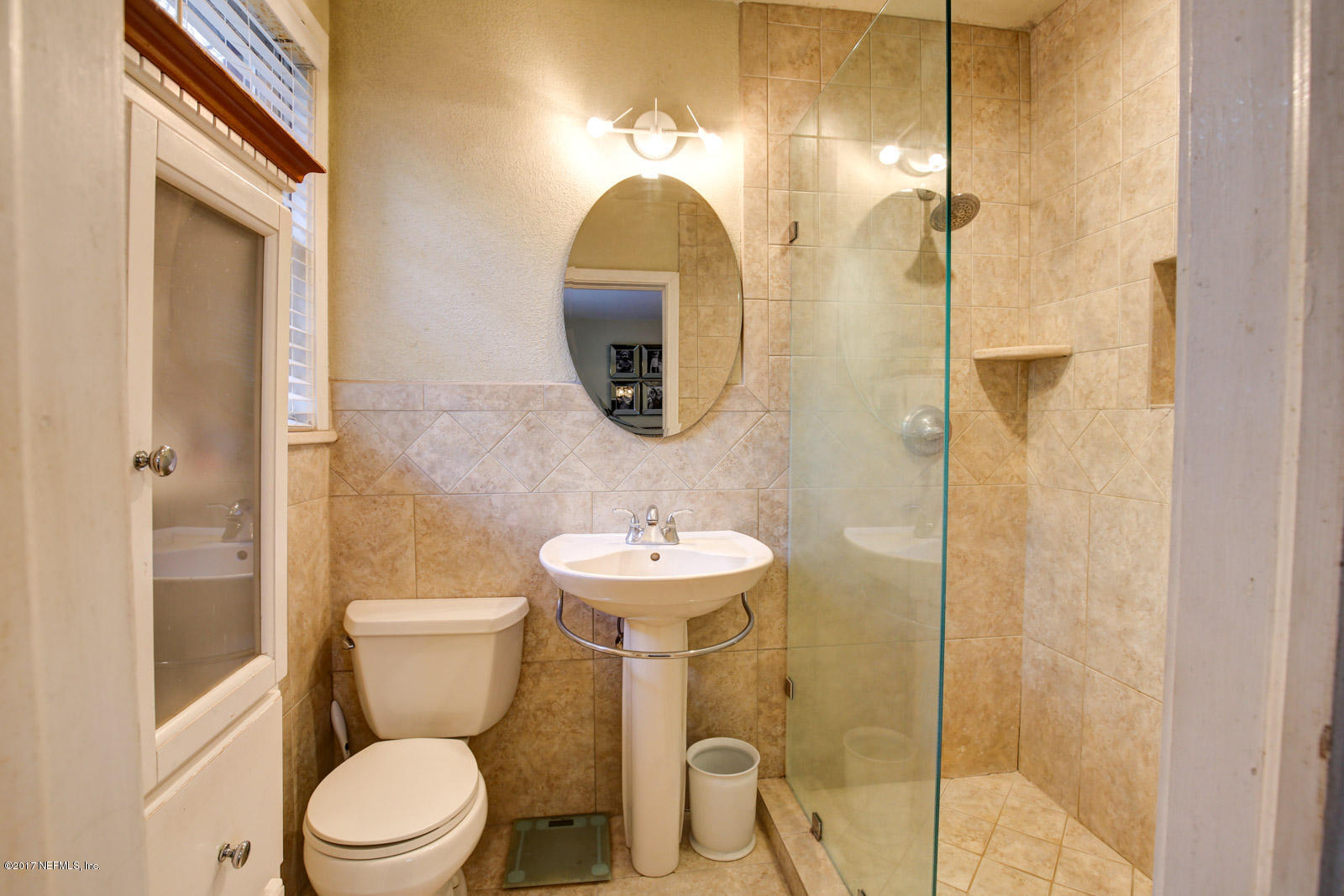 1361 Glengarry Road Jacksonville, FL 32207 - Photo 16 of 22 a bathroom with a toilet sink and shower