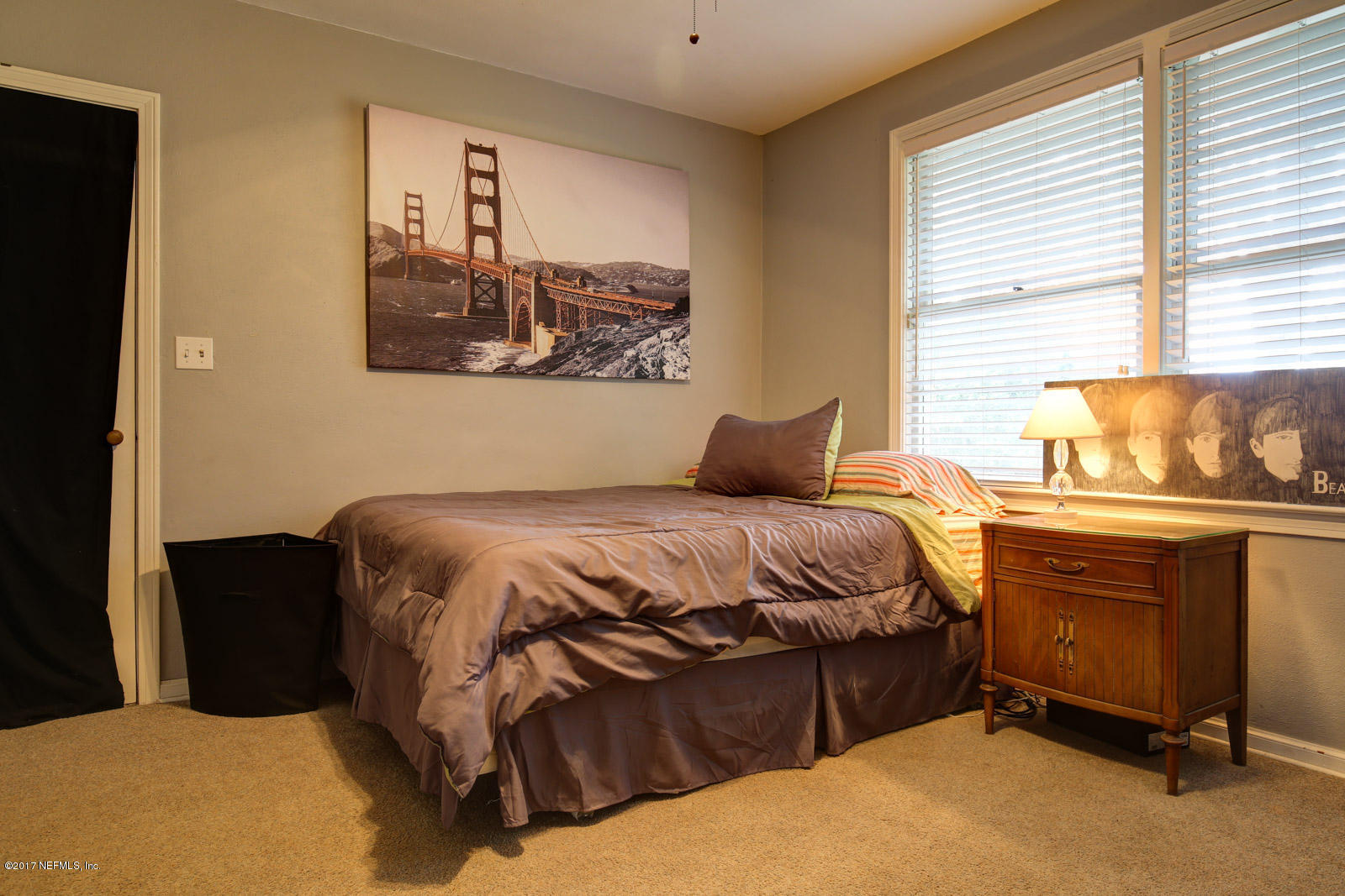 1361 Glengarry Road Jacksonville, FL 32207 - Photo 18 of 22 a bedroom with a bed and window