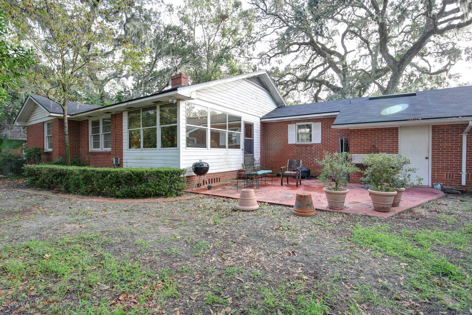 1361 Glengarry Road Jacksonville, FL 32207 - Photo 21 of 22 a view of a house with backyard sitting area and garden