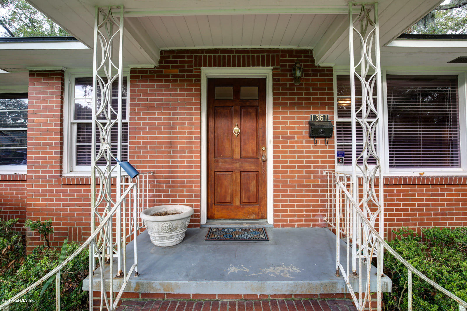1361 Glengarry Road Jacksonville, FL 32207 - Photo 3 of 22 a view of a door of a house with large windows