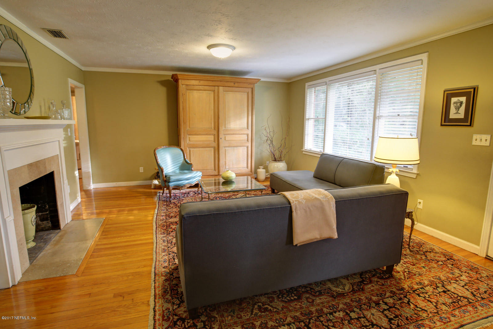 1361 Glengarry Road Jacksonville, FL 32207 - Photo 6 of 22 a living room with fireplace furniture and a fireplace