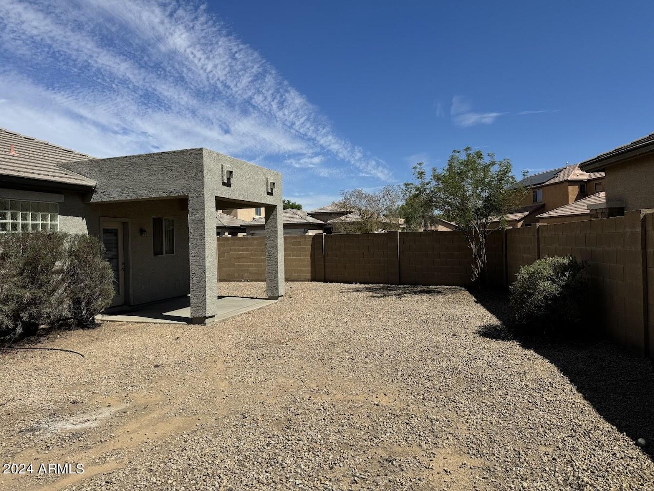 9401 West Berkeley Road Phoenix, AZ 85037 - Photo 25 of 27 a front view of a house with a yard