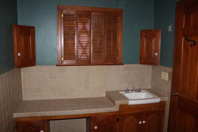 301 Watts Avenue Ralls, TX 79357 - Photo 9 of 10 a bathroom with a sink and a mirror