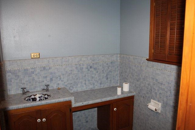 301 Watts Avenue Ralls, TX 79357 - Photo 10 of 10 a kitchen with a sink and cabinets