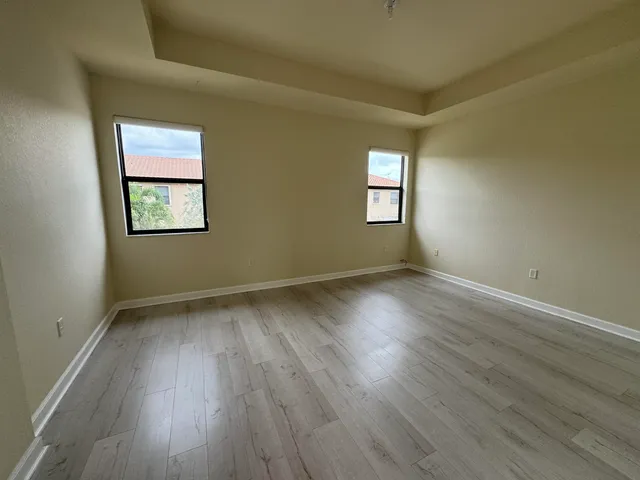 a bathroom with a double vanity sink a mirror and a bathtub