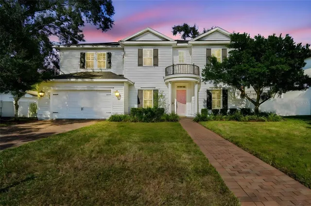 a view of a hallway with wooden floor and a hallway