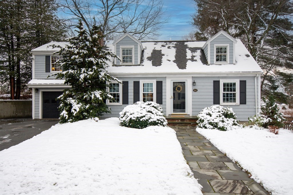 64 Grosvenor Road Needham, MA 02492 - Photo 1 of 36 a front view of a house with a yard and garage